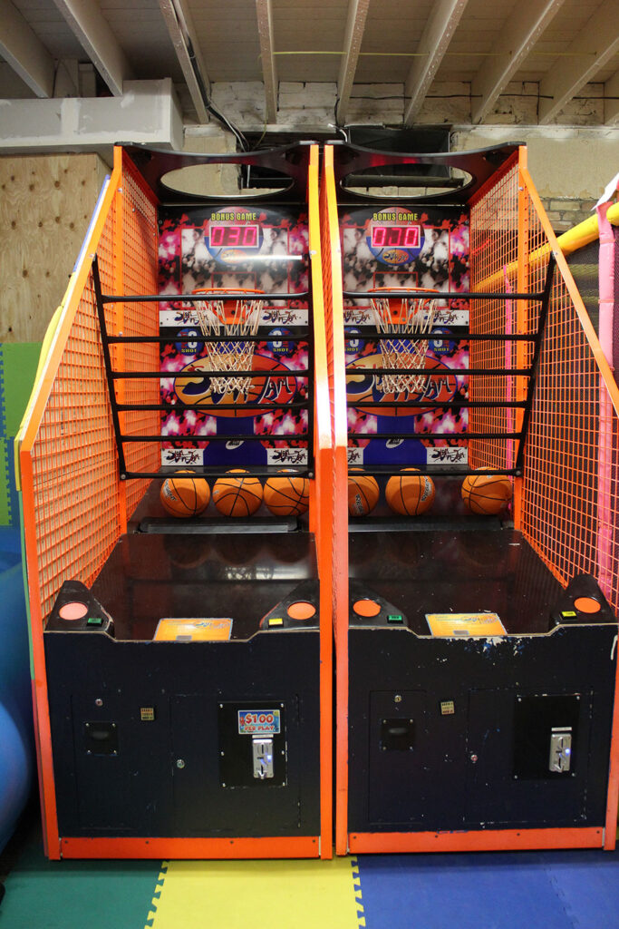 Two basketball arcade games side by side